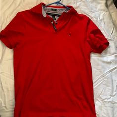 Red Tommy Hilfiger Polo, Never Worn Red Polo Collar Shirt For Summer, Classic Red Fitted T-shirt, Red Polo Collar T-shirt For Summer, Tommy Hilfiger Classic Short Sleeve Tops, Red Fitted Polo Collar T-shirt, Classic Fitted Red T-shirt, Red Casual Short Sleeve Polo Shirt, Red Cotton Polo Shirt For Spring, Casual Red Short Sleeve Polo Shirt