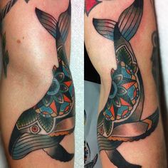 two tattoos on the legs of people with fish and flowers in their body, one is black