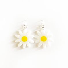 "x WHITE AND YELLOW DAISY EARRINGS x White and yellow daisy earrings with silver earring hooks.  x All acrylic is 1/8\" thick x Silver earring hooks x Please allow 5-7 business days for make + shipping." Daisy Shaped Earrings For Summer, Daisy-shaped Earrings For Summer, Summer White Hypoallergenic Jewelry, Trendy White Flower-shaped Earrings, Hypoallergenic White Summer Jewelry, Summer Hypoallergenic White Jewelry, Trendy White Handmade Flower Earrings, White Flower-shaped Trendy Earrings, Trendy Handmade White Flower Earrings