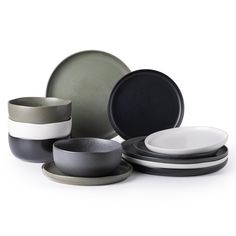 a group of plates and bowls sitting next to each other