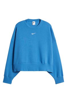 An embroidered Swoosh adds minimal branding to this cozy fleece sweatshirt cut for a relaxed, oversized fit that's enhanced by the dropped shoulders. 22" length (size Medium) Crewneck 80% cotton, 20% polyester Machine wash, tumble dry Imported Preppy Nike Sweatshirt, Cute Crew Neck Sweatshirts, Preppy Clothes For School, Tn Sweatshirt, Crew Neck Sweatshirt Aesthetic, Nike Sweatshirt Outfit, Lulu Sweatshirt, Popular Sweatshirts, Blue Sweatshirt Outfit