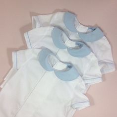 Page boy suit. Lined pale blue cotton shorts with attached braces. Elastic waist, adjustable braces. White cotton short sleeve shirt. Pleat and pin-tuck detail to front. Pale blue Peter Pan collar. Pale blue piping to collar and sleeves. Perfect little suit for any special occasion. Custom orders welcome...please ask. Shirt 6-12m Chest...29.5cm Length from nape to hem...31cm 12-18m Chest...31cm Length from nape to hem...33cm 18-24m Chest...31.5cm Length from nape to hem...37cm 2-3yr Chest...33.5 Blue Fitted Collared Set, Blue Collared Fitted Sets, Classic Cotton Sets For Summer, Blue Short Sleeve Sets For Daywear, Classic Cotton Summer Sets, Light Blue Fitted Short Sleeve Sets, Classic Blue Short Sleeve Set, Blue Cotton Shorts, Blue Peter