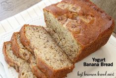 a loaf of banana bread sitting on top of a cutting board