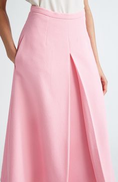 An inverted pleat at the front flaunts the crispness of Wickstead's tailoring skills on this midi skirt made from rosy, richly textured crepe. 32" length (size 18UK) Hidden back-zip closure Side-seam pockets Lined 95% polyester, 5% elastane Dry clean Made in the UK Designer Clothing Elegant A-line Maxi Skirt With Pleated Hem, Elegant Pink Evening Skirt, Feminine A-line Pleated Skirt, Feminine Evening Pleated Skirt, Elegant Pink Flared Maxi Skirt, Elegant Long Pink Skirt, Feminine Pleated Evening Skirt, Fitted Midi Maxi Skirt With Accordion Pleats, Feminine Pleated Skirt For Evening