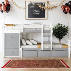 a bedroom with bunk beds and balloons on the wall