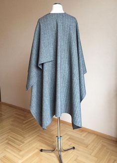 "80% Virgin wool 20% PL Size : Large Oversized Length - shoulder to hem : 100cm/ 39.4\" Width - Across back from armhole to armhole : 145cm / 57\" Care: Dry cleaning Ready to ship I ship internationally registered airmail with tracking number from Lithuania All Ruanas / wraps here https://www.etsy.com/shop/JPalKnits?ref=seller-platform-mcnav&section_id=26910076 I make all my designs in a pet-free and smoke-free environment Thank you for visiting my shop https://www.etsy.com/shop/JPalKnits Wi Oversized Gray Cape For Fall, Oversized Wool Poncho With Long Sleeves, Oversized Gray Poncho For Fall, Gray Oversized Poncho For Winter, Oversized Gray Poncho For Winter, Oversized Wool Shawl Outerwear, Ladies Poncho, Wool Poncho, Wool Shawl