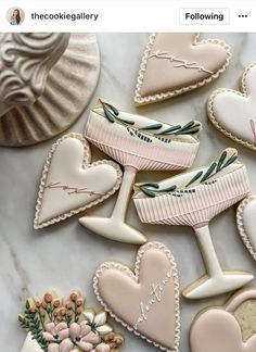 decorated cookies are arranged on a marble surface