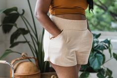 Our Piedra Shorts are made from organic cotton french terry so the fabric has a nice weight feel and durability. The shorts have two front pockets perfect for stashing anything and small pleats on the front and back to give them some shape and structure. The waist belt is made from bobbin elastic creating a stretchy and soft band for your belly. The legs are wide and the crotch is low, making these shorts super comfortable and perfect for many adventures. They are available in 4 French Terry col Comfortable Knee-length Shorts With Elastic Waistband, Solid Color Bottoms With Elastic Waistband In Organic Cotton, Organic Cotton Shorts For Summer Loungewear, Organic Cotton Loungewear Shorts For Summer, Comfortable Shorts With Elastic Waistband For Everyday, Everyday Organic Cotton Bottoms With Pockets, Comfortable Beige Cotton Shorts, Organic Cotton Shorts With Elastic Waistband For Summer, Organic Cotton Shorts For Loungewear