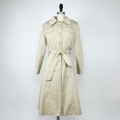 Vintage 1970's hooded trenchcoat in cream Features six functional buttons down the front, a removable sash belt, removable hood, removable liner, has spacious pockets & buttons on the sleeve cuffs Good condition with no real wear Measurements  Bust - 21" flat  Length - 41" Sleeve length - 29" Contents  Shell - 100% Acrylic Liner - 100% Polyester Please message with any questions ❤️ Sash Belts, Sash Belt, Olympia, Trench Coat, 1970s, Jackets For Women, Jackets & Coats, Sleeve Length, Cream