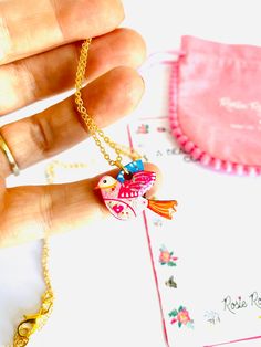 Beautiful little illustrated bird necklace Necklace Basics * Pretty little dainty bird necklace charm. * Laser cut with hard resin to give a glass affect, finished with pretty gems. * Original illustration by Rosie Parker... bring the illustration of this beautiful lady to life. * Dainty gold filled chain. * 18 inch cm drop drop length, fits perfectly on your chest. Why buy me? * I'm very lightweight - you hardly know I'm there! * Beautiful gift idea. * I'm a show stopper statement earrings. * I Bohemian Heart Pendant Charm Necklace Gift, Cute Pendant Charm Necklace For Gift, Handmade Cute Jewelry As Gift For Mom, Cute Handmade Jewelry As Gift For Mom, Whimsical Heart Charm Jewelry Gift, Whimsical Heart Charm Jewelry For Gift, Tiny Pendant Necklace For Gifts, Tiny Pendant Necklace Gift, Cute Round Pendant Charm Necklaces As Gifts