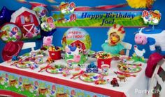 a child's birthday party with farm animals and farm animal decorations on the table