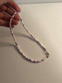 This bracelet is handmade by FeelGood by Abbi. White, pink, purple  glass sead bead necklace. Sead Bead Necklace, Purple Bead Necklace, White Beaded Necklace, Purple Glass, Purple And White, Beaded Necklaces, Pink And Purple, Bead Necklace, Chain Styles