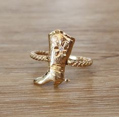 Vintage Cowgirl Boot Lasso Rope Diamond Ring | Rodeo | Cowboy | Estate 14k Yellow Gold What a fun find! Of course we are here in Oklahoma so what else would we have for you but a DIAMOND cowgirl/cowboy boot? Center diamond measures approximately 2.5 mm/ 0.06ct. Substantial 14k Yellow Gold. Wonderful Lasso rope shank. Nice low rise for daily wear. DETAILS: Measurement of the face -17 x 12  mm Height- 2.6 mm high off of the finger Size 7.5 and can be resized by your jeweler or by ours for an addit Diamond Cowgirl, Lasso Rope, Cowgirl Boot, Cowgirl Cowboy, Rodeo Cowboy, Vintage Cowgirl, Cowboy Boot, Mobile Device, Cowgirl Boots