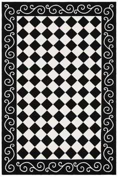 a black and white rug with an intricate design