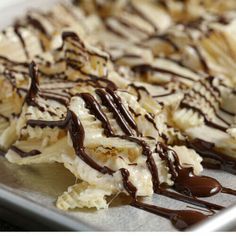 some kind of desert with chocolate drizzled on it