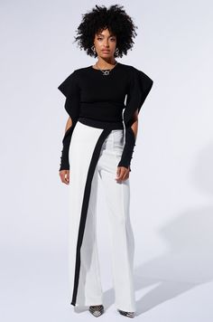 Keep your standards high, babe. The AKIRA Label Be Better Pant is crafted from a stretchy sleek knit fabrication and features a high rise design, tonal stitching, a back zipper closure, and a wide leg silhouette. Complete with a slanted fabric overlay with contrast trim that drapes across one leg for a dramatic effect. Pair with pointed pumps and a button down blouse for a spicy formal fit. - Self: 95% Polyester 5% Spandex- Stretchy- Imported (all measurements approximate from size small)- 13” Rise- 34” Inseam- Model is 5’9 ½” Product ID: 437999 Keep Your Standards High, All White Party, Pointed Pumps, White Accessories, White Party, Fall Fashion Outfits, Be Better, White Outfits, Contrast Trim