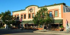 an orange building with a clock on the front