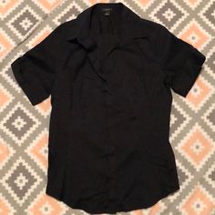 *Ann Taylor Black Low Vneck Button Down Short Sleeve Blouse Size 10.. Has Button On Each Cuffed Sleeve, Slight Stretch..Excellent Condition, Like Brand New Preowned.. No Flaws.. 75%Cotton 22% Nylon 3%Spandex.. *Feel Free To Ask Any Questions *Like And Bundle To Save **Reasonable Offers Always Welcome** Black V-neck Shirt With Buttons, Formal V-neck Shirt With Buttons, Black Short Sleeve Shirt For Office, Black Tops With Collared Neckline And Buttons, Black Tops With Buttons And Collared Neckline, Black Collared Top With Buttons, Black Tops With Buttoned Collared Neckline, Black Collared Top With Button Closure, Black Top With Button Closure And Collared Neckline