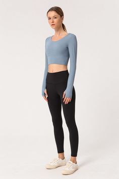 The Emes Shop shirt is detailed with long sleeves and thumbholes. Features a round neckline and an open back with a criss cross design. Pair this buttery soft. light-weight. quick-drying workout top with your favorite pair of leggings and sneakers for an easy morning run outfit.MATERIAL: 80% Nylon. 20% SpandexMEASUREMENTS: Small | Bust: 72"cm . Sleeve length: 57" cm . Length: 37" cm Medium | Bust: 76" cm . Sleeve length: 58" cm . Length: 38" cm Large | Bust: 80" cm . Sleeve length: 59" cm . Leng Stretch Long Sleeve Top With Thumbholes, High Stretch Crew Neck Long Sleeve Top With Thumbholes, High Stretch Crew Neck Top With Thumbholes, Versatile Stretch Long Sleeve Top With Thumbholes, Solid High Stretch Long Sleeve Top With Thumbholes, Stretch Crew Neck Long Sleeve Workout Top, Stretch Crew Neck Long Sleeve Top For Workout, Athleisure Long Sleeve Top With Thumbholes, Stretch Long Sleeve Yoga Top