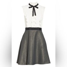 Ted Baker London Karoll Skater Dress, Black And White. Sharp, Classy, Sophisticated, Figure Flattering Retro Look. Pearlized Buttons Front Top. Standup Pleated Neck With Bow. Pleated Ruffles Down Front And Back. Side Zipper. Sleeveless. Sparkly Metallic Woven Skirt. 2 Hidden Side Pockets. Ted Baker Size 4, Equal To Us Size 10. Excellent Gently Used Condition. Worn 2 Times. No Damages, Stains, Marks, Rips. Smoke And Pet Free Home. Same Day Shipping! Elegant Mini Dress With Ruffles For Work, Elegant Ruffled Mini Dress For Work, Elegant Mini Ruffle Dress For Daywear, Elegant Mini Length Ruffle Dress For Daywear, White Ruffled Mini Dress For Work, Elegant Daywear Mini Dress With Ruffles, Elegant Mini Dress With Ruffles For Daywear, Elegant Ruffled Mini Dress For Daywear, Chic Ruffle Dress For Work