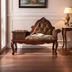 an ornate wooden bench in the corner of a room with a painting on the wall