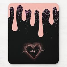 a pink and black mouse pad with dripping hearts