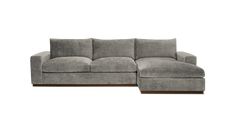 a large gray couch sitting on top of a white floor