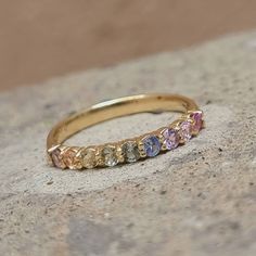 ✨💎 Beautiful mid eternity pastel rainbow ring Perfect ring, with seamless fit and comfort .... Details .... Made to order, with love ♥ Marked 14k solid Gold ♥ Ring width: 2.5mm ♥ Gemstone: 100% natural sapphires ♥ Shape And Cut: Brilliant round, Excellent quality ♥ Gem size: 2.5mm PROCESSING & SHIPPING *We offer shipping worldwide! *All items are fully insured and traceable online *The ring comes nicely packed in velvet ring box and lovely note Feel free to contact us for extra photographs, cheerfully provided 😇 Rainbow Engagement Rings, Colourful Wedding Band, Rainbow Wedding Ring, Colorful Wedding Band, Rainbow Wedding Band, Pastel Rings, Ethereal Jewelry, Sapphire Eternity Band, Gold Schmuck