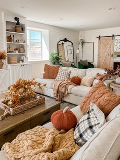 a living room filled with lots of furniture and decor