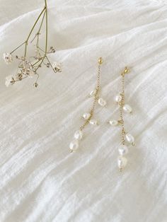 Pearl earrings, freshwater pearls, rice pearls, dangle pearl earrings, delicate earrings, wedding earrings, bridesmaid earrings, bridesmaid gift, bridesmaid jewelry, bridal jewelry, dainty pearl dangles, pearl chain earrings Pearl Chandelier Earrings With Pearl Chain As Gift, Dainty White Pearl Drop Chandelier Earrings, Delicate Pearl Charm Dangle Earrings, Delicate Pearl Charm Drop Chandelier Earrings, Delicate Dangle Earrings With Pearl Charm, Delicate Chandelier Earrings With Pearl Charm, Delicate Chandelier Drop Earrings With Pearl Charm, Gift Pearl Charm Dangle Chandelier Earrings, Delicate Pearl Drop Chandelier Earrings As Gift