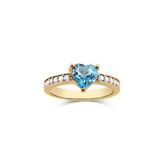 Heart-Shaped Blue Topaz and Diamond Ring in 14k Yellow Gold Show your love with this enchanting Heart-Shaped Blue Topaz and Diamond Ring, exquisitely crafted in 14k yellow gold. Features a 7mm heart-shaped natural blue topaz gemstone 12 natural diamonds (SI1, G color) set along the band Made from high-quality 14k yellow gold 3mm wide band for a comfortable fit Custom engraving available Includes a cleaning cloth, certificate of authenticity (COA), a pouch, and a box Ideal for those who appreciate elegant and timeless jewelry, this stunning blue topaz and diamond ring is perfect for special occasions or everyday wear. Add this beautiful piece to your collection today and let your love sparkle. Yellow Gold Heart Cut Ring With Center Stone, Heart Cut Blue Topaz Rings For Anniversary, Yellow Gold Heart Cut Ring With Accent Stones, Anniversary Heart Cut Topaz Ring Fine Jewelry, Yellow Gold Heart Ring With Accent Stones, Topaz And Diamond Ring, Heart Wedding Rings, Blue Topaz Gemstone, Love Sparkle