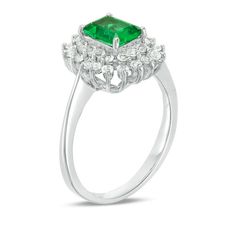 Elevate her attire with this gorgeous fashion ring. Created in sterling silver, this stately choice sparkles with a 6.10 x 4.10mm emerald-cut lab-created verdant-green emerald wrapped in two sunburst frames of lab-created white sapphires. Buffed to a brilliant luster, this style makes a romantic gift for her. Custom-made to fit her ring size. Sterling silver rings cannot be resized after purchase. Luxury Emerald Cut Cluster Ring For Formal Occasions, Luxury Emerald Cut Cluster Ring For Formal Events, Formal Rectangular Emerald Ring With Center Stone, Formal Square Cut Diamond Ring With Halo Setting, Timeless Emerald Ring With Accent Stones For Formal Occasions, Emerald Cut Gemstone Halo Ring In White Gold, Timeless Formal Emerald Ring With Accent Stones, Formal Rectangular Emerald Ring With Prong Setting, Square Cut Halo Ring For Formal Occasions