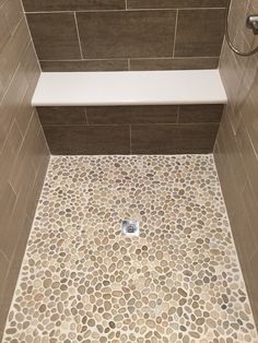 Natural Tan-White-Gray Leveled Pebble Mosaic 12 x 12 Pebble Tile Shower, Shower Pan Tile, Ideas Baños, Beton Design, Pebble Tile, Floor Bathroom, Diy Bathroom Remodel, Bathroom Shower Tile, Bathroom Remodel Shower