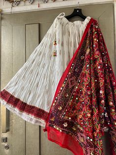 Elevate your traditional attire with super soft cotton white ghaghra skirt, adorned with intricate hand block prints. This ready-to-wear skirt paired with red fully embroidered dupatta is designed to capture the essence of festivity and celebration. Plus, you have the flexibility to choose your own dupatta, making this combo offer an exceptional choice for a variety of occasions. Let's explore the incredible features of this ensemble that make it an absolute must-have for your Garba and Dandiya Unstitched Cotton Choli With Dupatta, Unstitched Cotton Lehenga For Festivals, White Cotton Dupatta For Traditional Ceremonies, Cotton Sharara With Traditional Drape For Festivals, White Cotton Dupatta With Cutdana, White Bohemian Lehenga With Dupatta, Bohemian Bandhani Print Cotton Lehenga, Bohemian White Traditional Wear With Patterns, White Bohemian Traditional Wear With Drape