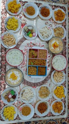 a table topped with plates filled with different types of food