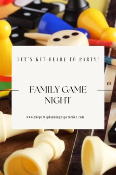 a family game night with plastic toys and a sign that says let's get ready to party