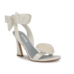 Nine West-Krave Sandal Look like a work of art in this gorgeous Nine West Krave sandal. A flower embellishment on the upper sits beautifully, making you fashionably intimidating wherever you go. The tie closure makes it even exciting and the tapered heel ties everything together. Flower Heels, Bridal Design, Bridal Women, Walk Down The Aisle, Colorful Heels, Wedding Shoes Heels, Bridal Designs, Dress Sandals, White Satin