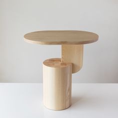 a wooden table sitting on top of a white counter