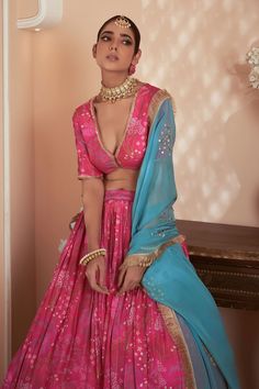 Pink attached cancan lehenga with floral prints. Comes with matching padded blouse and contrast blue embroidered, fringed border dupatta. - Aza Fashions V Neck Lehenga, Pleated Lehenga, Cancan Lehenga, Lehenga Pattern, Padded Blouse, Floral Type, Pink Lehenga, Set For Women, Floral Printed