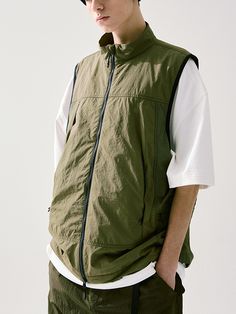 This is a casual and comfortable vest that is made out of high quality nylon 100% fabric. With design detail of 2-way zipper closure, inner zipper pocket, and console zipper pockets on the side, it gives a trendy and casual mood.- 2-way zipper closure- Adjustable string and stopper on the hem- Inner zipper pocket- Relaxed armhole for comfortable wear Casual Streetwear Vest With Functional Pockets, Spring Outdoor Nylon Vest, Functional Nylon Vest With Zipper Closure, Techwear Nylon Vest For Streetwear, Functional Outdoor Vest With Zipper Closure, Nylon Vest For Streetwear, Sleeveless Nylon Outerwear For Streetwear, Sleeveless Outerwear With Zipper Closure, Outdoor Nylon Vest With Zipper Closure