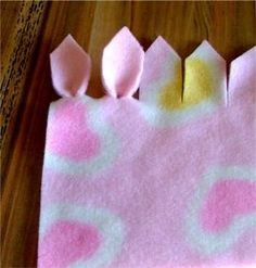 a close up of a piece of paper on a table with pink and yellow designs