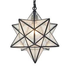 a moravian star light hanging from the ceiling with two lights on each side and one light in