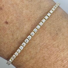 Beautiful diamond bracelet gold.  Excellent craftsmanship, the diamonds are nice and super sparkling.  The setting really shows off the diamonds beautifully.  About 2.1mm  width.  Wear this simple and beautiful bracelet by it self or stack with other bracelets.  Lays perfectly on the wrists, won't flip over.  There's two safety clasp for a secure fit.  This bracelet is perfect for everyday wear, it's not too big and not small. 7" in length.  Good quality diamonds, no black carbon spot when viewed under a magnifying glass.   Genuine Earth Mined Round Brilliant Cut Diamonds Natural  Total weight: 2.29 Carats Clarity: SI1 Color: F All shiny and white diamonds, no cloudy or yellowish stones  Solid 18K Yellow Gold 6.39 grams Comes with gift box AT10400 Fine Jewelry Gold Diamond Bracelet Vvs Clarity, Yellow Gold Diamond Bracelet With Diamond Cut, Diamond White Diamond Bracelet With Jubilee Design, Fine Jewelry Diamond White Gold Bracelet, Diamond White Jubilee Diamond Bracelet, Diamond White Brilliant Cut Gold Bracelet For Anniversary, Diamond White Gold Bracelet With Brilliant Cut For Anniversary, Diamond White Gold Bracelet With Brilliant Cut, Brilliant Cut Diamond White Gold Bracelet For Anniversary