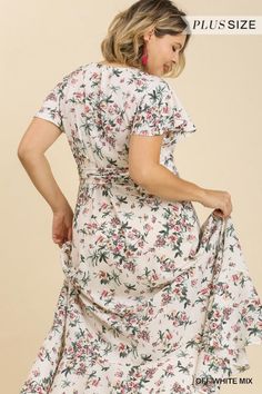 This feminine floral maxi dress is your ticket to a magical summer escape. Its breezy wrap silhouette and ruffle sleeves channel carefree boho vibes, while the vibrant floral print summons visions of sunny meadows and fragrant blooms. Made of a lightweight [poly] blend, it's perfect for balmy days and steamy nights. Whether you're dancing barefoot at an outdoor music festival or strolling the beach at sunset, this whimsical wonder will make every moment feel like an adventure. Pair it with strap Flowy Summer Wrap Dress With Flutter Sleeves, Feminine Flowy Maxi Wrap Dress, Feminine Flowy Maxi Dress With Surplice Neckline, Feminine Flowy Maxi Length Wrap Dress, Modest Ruffled Maxi Dress For Summer, Flowy Feminine Maxi Length Wrap Dress, Modest Floral Dress With Ruffles For Spring, Breezy Spring Maxi Dress With Floral Print, Spring Breezy Maxi Dress With Floral Print