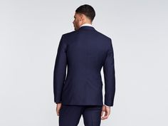 The men are wearing the Hemsworth Navy suit by Indochino Navy Fitted Suit With Long Sleeves, Navy Fitted Long Sleeve Suit, Navy Fitted Long-sleeve Suits, Navy Notch Lapel Suits For Workwear, Navy Double-breasted Suit With Notch Lapel, Navy Fitted Double Breasted Suit With Notch Lapel, Navy Slim Fit Blazer For Work, Navy Fitted Three-piece Suit For Office, Navy Professional Office Suits