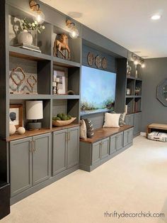 a living room filled with lots of gray furniture