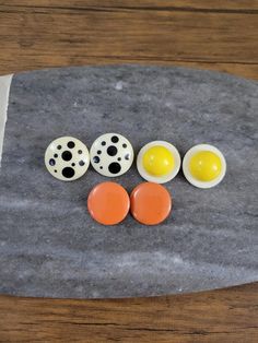 "This listing is for 3 Pairs of Vintage Clip-on Earrings Super Retro and Fun!! Earrings are from the 80s Polka Dot Earrings are 1.2\" and in Great Vintage Condition Yellow Earrings are 1.15\" and in Great Vintage Condition. Reminds me of Sunnyside Up Eggs!! Orange Earrings are 1\" and in Good Vintage Condition. One of the Earrings has Some Small Scuffs or Scrapes. *Reduce, Reuse and Recycle!! All of my Vintage items are a Great way to give the Planet a Fashionable High Five!! *Gift Wrapping Avai Retro Yellow Earrings For Party, Retro Yellow Party Earrings, Yellow Retro Party Earrings, Retro Clip-on Earrings For Gift, Vintage Orange Earrings For Party, Orange Vintage Earrings For Party, Retro Multicolor Clip-on Earrings, Sunnyside Up Eggs, Egg Earrings