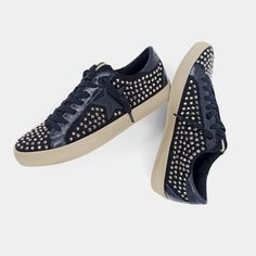 ROCK STAR is a brilliant update on court-inspired sneakers. The visually clean design includes allover metallic studs for a cool edge to the retro sneaker trend. SIZE GUIDE Sneaker Trend, Scout Bags, Flat Wedges, Sweater Layering, Soft Sock, Trending Sneakers, Black Rock, Capri Blue, Retro Sneakers