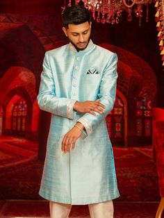 Color - Blush Baby Blue Customization of this Sherwani will require 4 weeks. Woven Silk Jacquard Sherwani in Sky blue, comes with Gold pants. Available Size: 40, 42, 44 (Ready to Ship)For all other sizes Customization: 3 to 6 weeksDupatta/ Shawl, Mojari/ shoes, Safa/ Pagri and Jewelry can be customized as per requirement. Blue Semi-stitched Traditional Wear For Formal Occasions, Blue Formal Unstitched Suit With Traditional Drape, Blue Wedding Salwar Kameez With Naqshi Detailing, Elegant Blue Salwar Kameez With Naqshi, Traditional Blue Unstitched Suit For Formal Occasions, Traditional Blue Unstitched Suit For Formal, Blue Kurta With Traditional Drape For Formal Events, Blue Semi-stitched Sherwani For Diwali, Unstitched Blue Nehru Jacket With Dabka