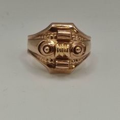 This is an antique ring from the Biedermeier period. The face of the ring is hollow worked as it was common for Biedermeier jewelry.  It's 8k gold. Very unusal! The ring look a little bit like a tank ring or an asian dragon mask to me. Inner diameter is 20mm Approx. size: US 10, UK U 1/2, German 63 It's resizeable! Weight: 4,10gr The pictures are a part of the description & they are enlarged for a better description! Please also have a look at wearing pictures and the dimensions!  The boxes in t Antique Engraved Ring With Decorative Band, Antique Ceremonial 14k Gold Rings, Antique 14k Gold Ceremonial Rings, Antique 14k Gold Rings For Ceremonial Occasions, Antique Hallmarked Gold Dome Ring, Victorian Style Gold Collectible Rings, Victorian Rings With Decorative Band For Formal Events, Antique 14k Rose Gold Rings, Antique Hallmarked Yellow Gold Dome Ring